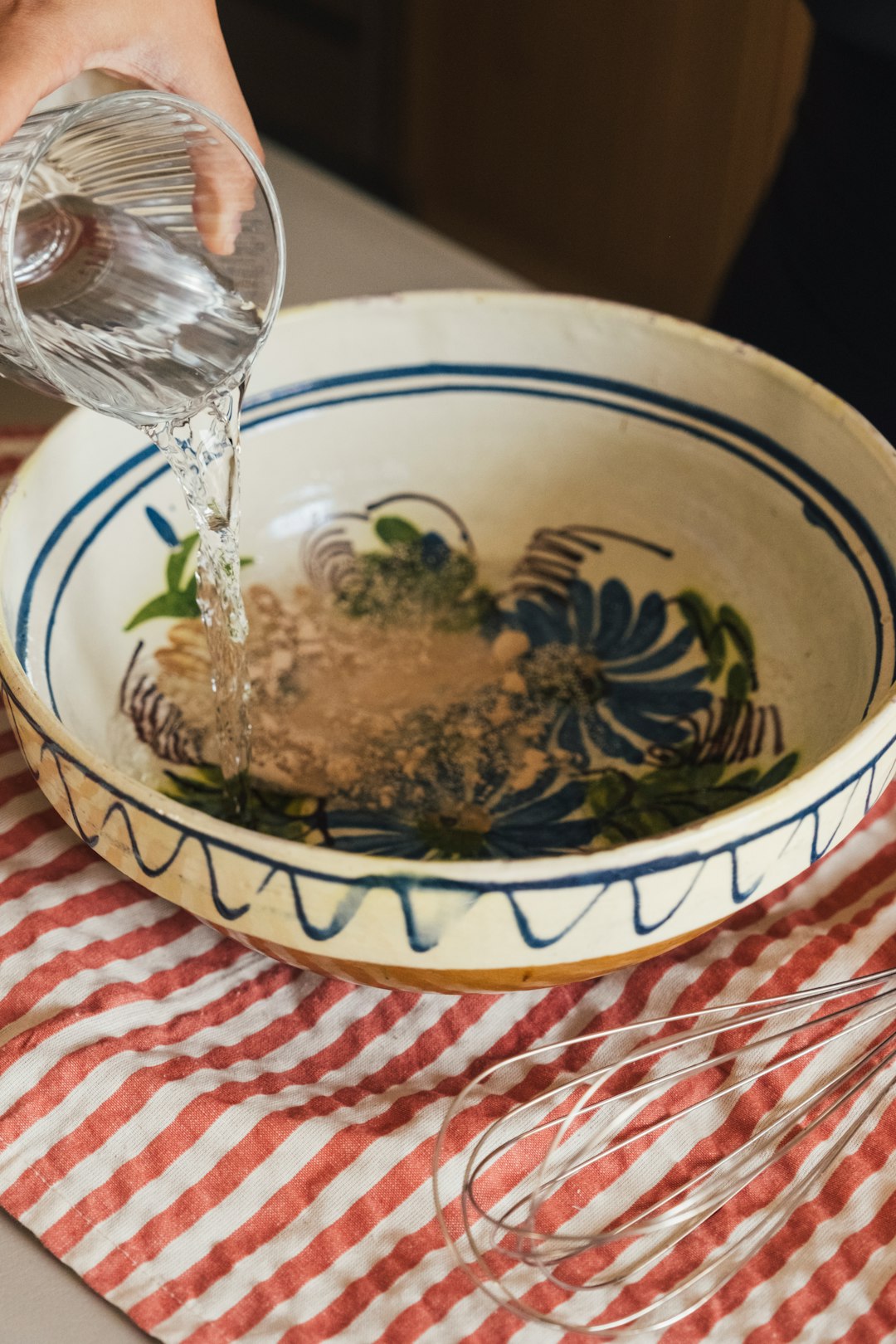 water-being-poured-into-a-decorative-bowl-56oxojxjr3g